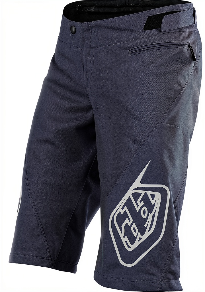 Male cyclist wearing Troy Lee Designs shorts on a mountain trail